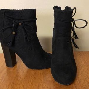 Tassel tie detail high ankle booties.